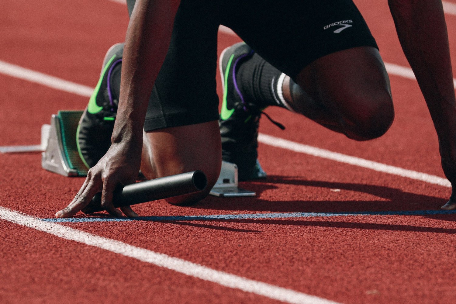 Athlete in starting blocks on a track